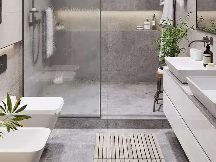 Reforma integral de bano en Valencia con azulejo gris, ducha integrada y mueble de lavabo contemporaneo